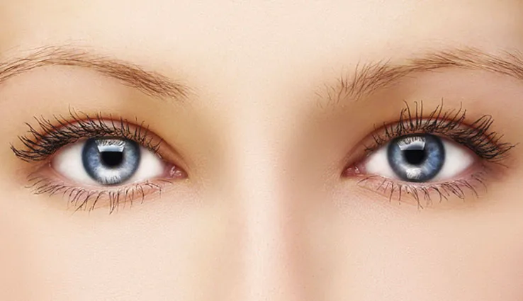 A zoom in on bright blue eyes and smooth skin around eyes.
