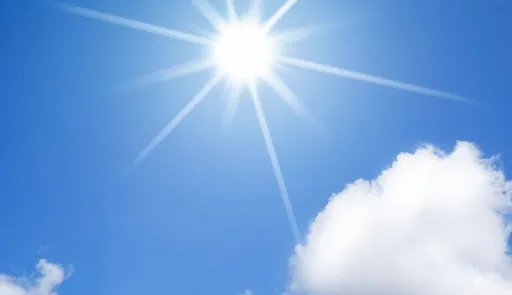 Beams of light stretching out from the sun against a bright blue sky.