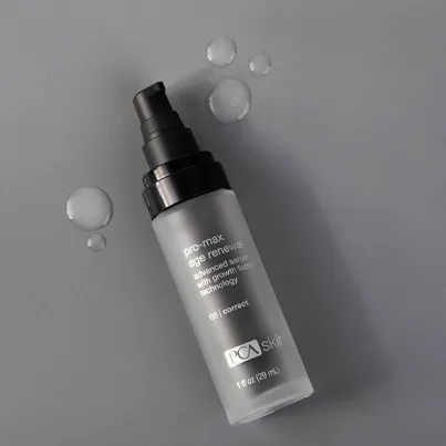 Pro-Max Age Renewal on gray background with serum spots